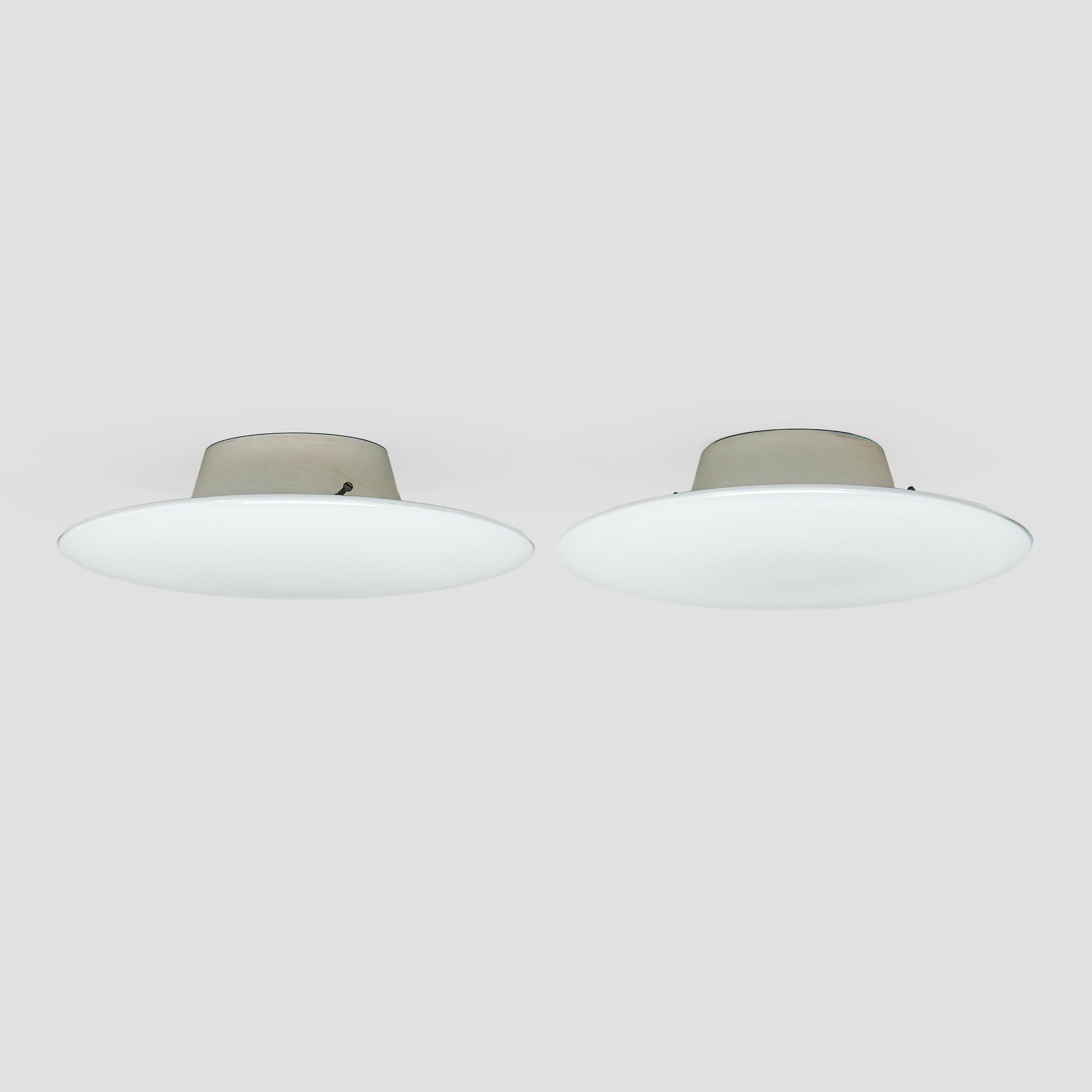 Arne Jacobsen, a pair of 1960's 'AJ-Eklipta' ceiling/wall lamps, for Louis Poulsen/licensed manufacturer Orno, Stockmann.