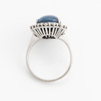 Ring with cabochon-cut sapphire and brilliant-cut diamonds.