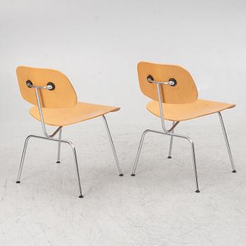 Charles & Ray Eames, a set of four 'DCM' chairs, Vitra, dated 2002.