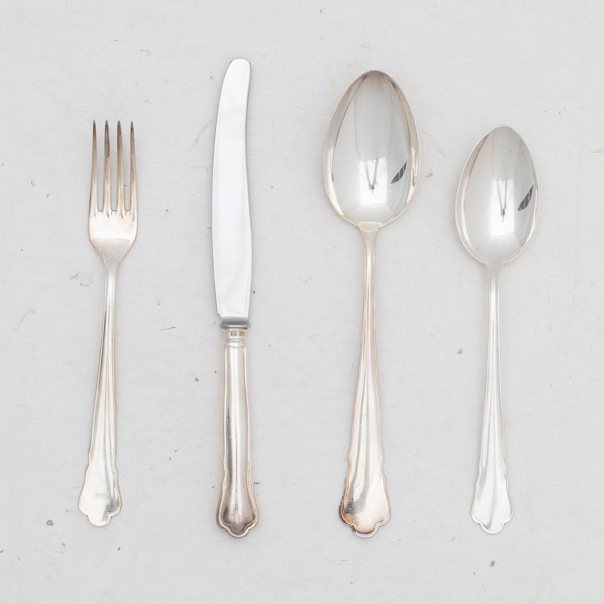 Guldsmedsaktiebolaget (GAB), A 24 piece 'Chippendale' silver cultery service, Stockholm 1950's.