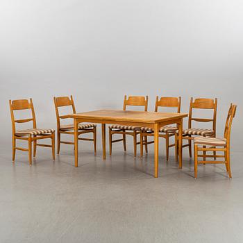 A CARL MALMSTEN DINING TABLE and CHAIRS, 7 parts.