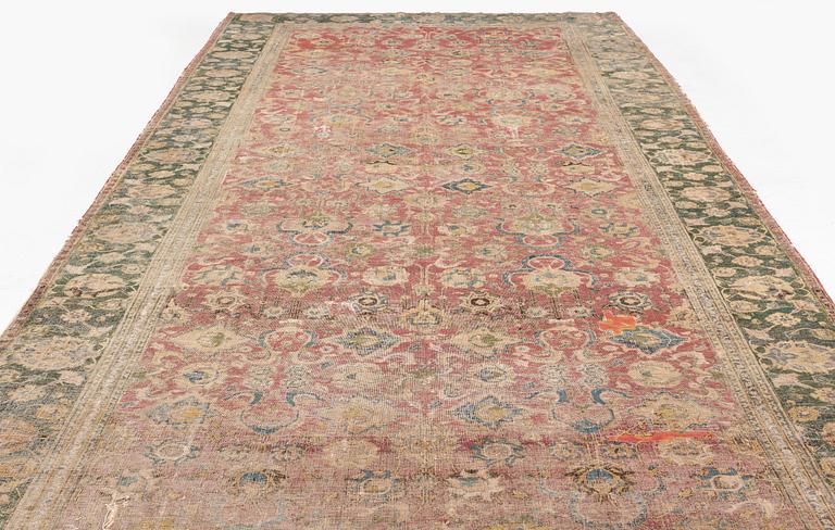 A safavid 'Spiral vine' Esfahan carpet, central persia, mid to second haft of the 17th century. Ca 562 x 231 cm.