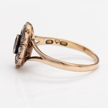 A 14K gold ring with a sapphire and diamonds ca. 0.24 ct in total. Eero Eskelinen.