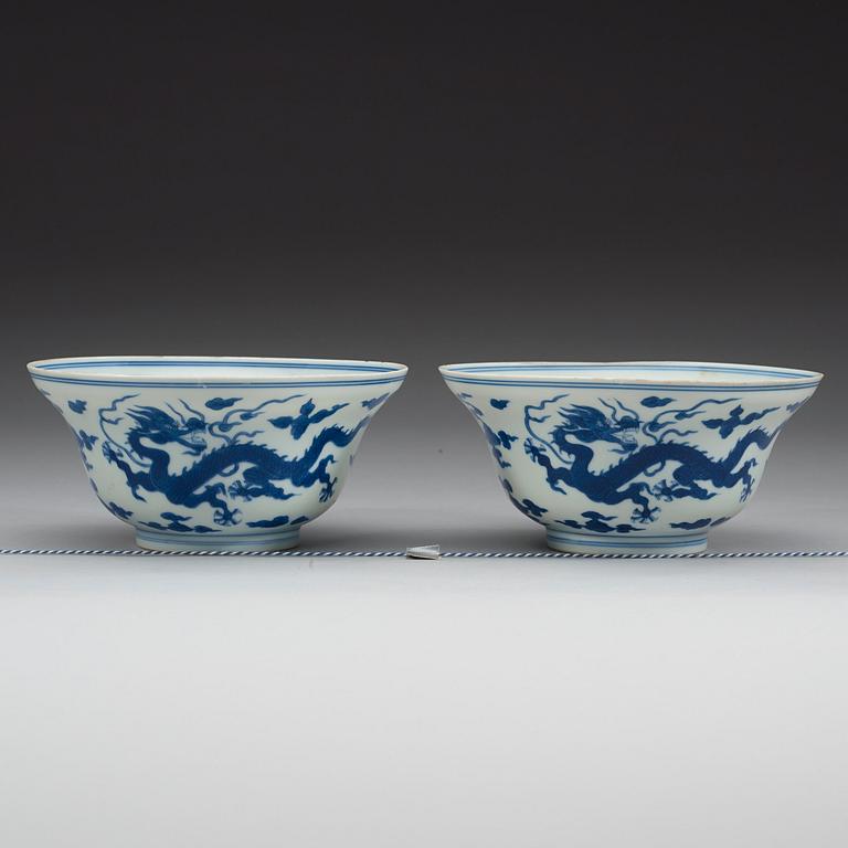 A pair of blue and white five clawed dragon bowls, Qing dynasty with Qianlong's sealmark and period (1736-95).