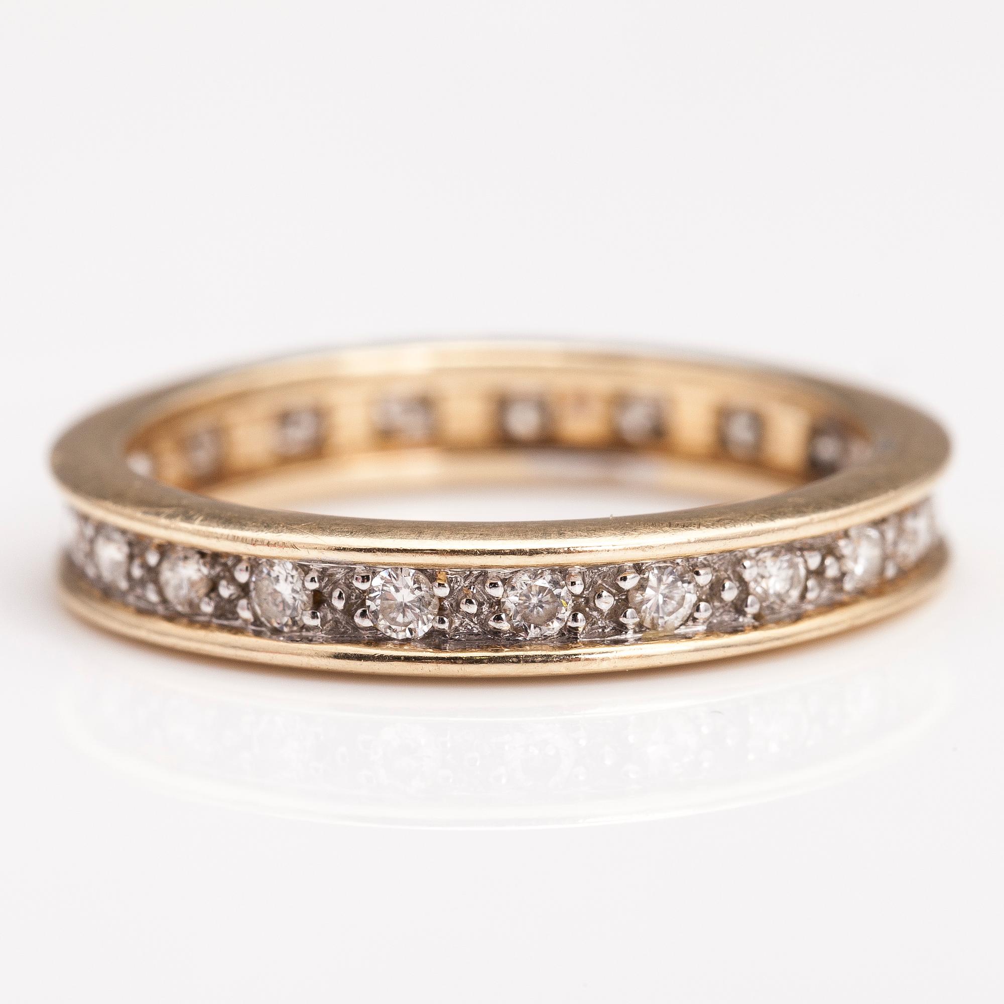 A 14K gold ring with diamonds ca. 0.21 ct in total. Timantttiset, Helsinki 2002.