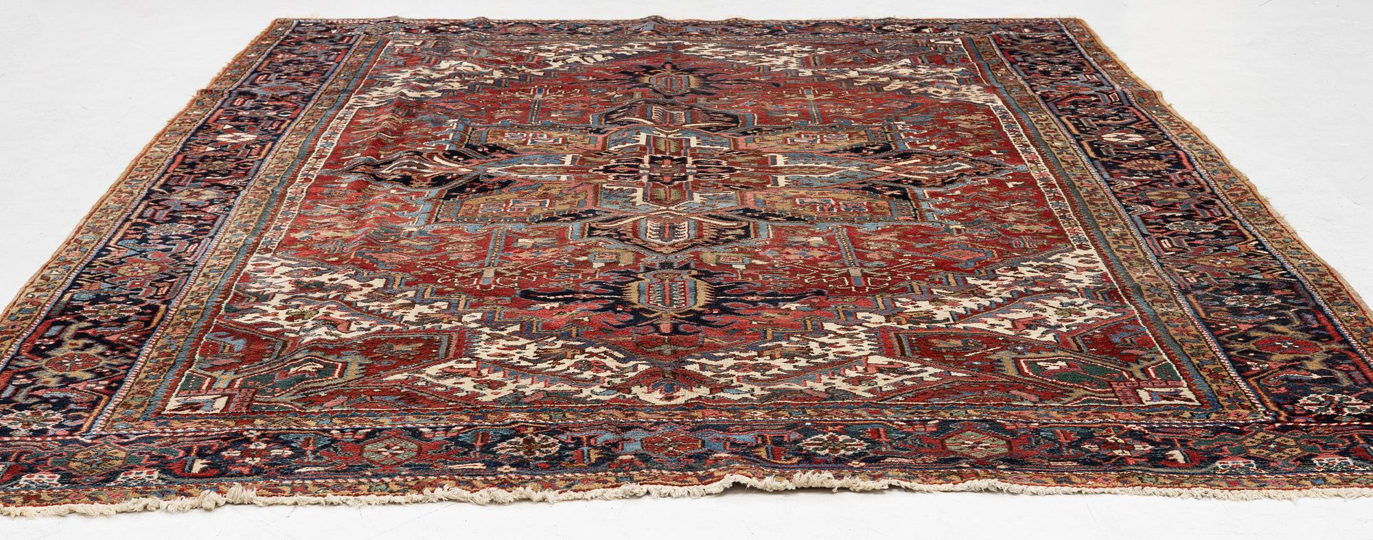 A semi-antique Heris carpet, west persia c. 322 x 252 cm.