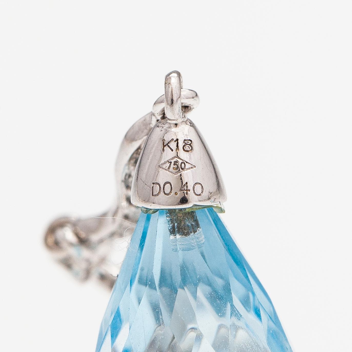 A pair of 18K white gold earrings with topazes and diamonds ca. 0.37 ct in total.