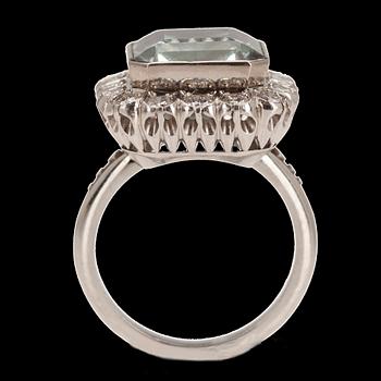 A RING, Beryl c. 6.00 ct, brilliant cut diamonds c. 0.64 ct. ~H/I. Platinum. 1960 s. Size 16+, weight 11 g.