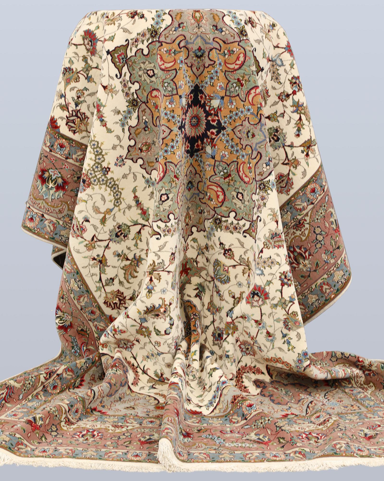 A part silk Tabriz carpet, so-called 50 Raj, approx. 356 x 250 cm.