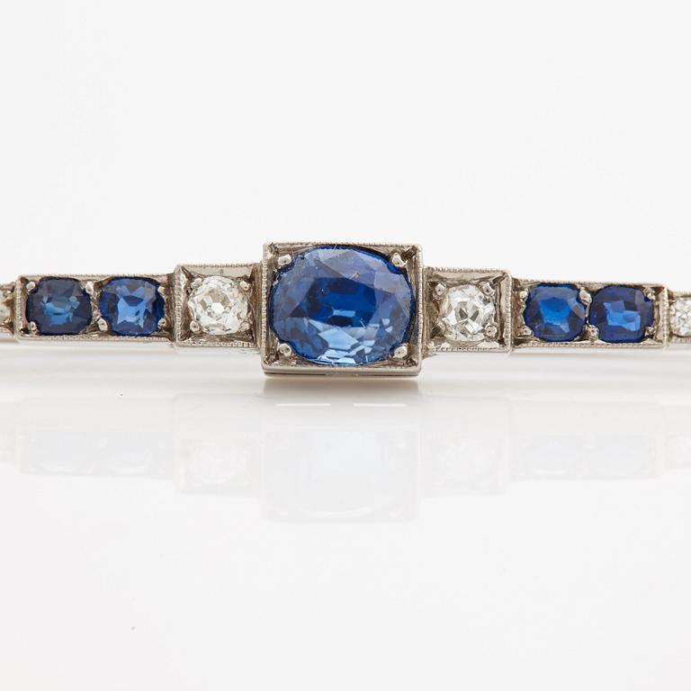 A brooch set with sapphires, old- and rose cut diamonds.