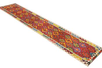 A runner carpet, Kilim, c. 497 x 84 cm.