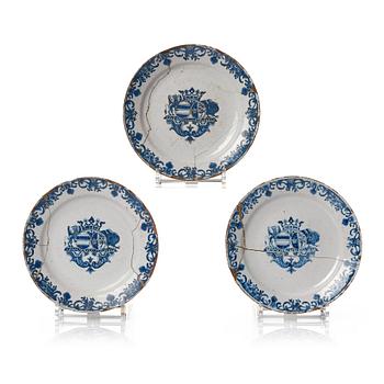 329. A set of three French Rouen dinner plates with the arms of Bielke Piper, early 18th Century.