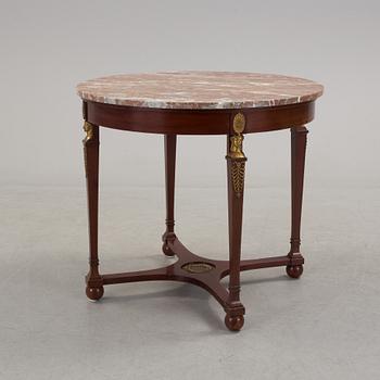 An empire-style table, early 20th century.