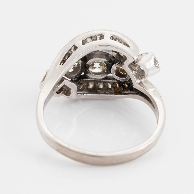 Platinum, brilliant and baguette cut diamond ring.