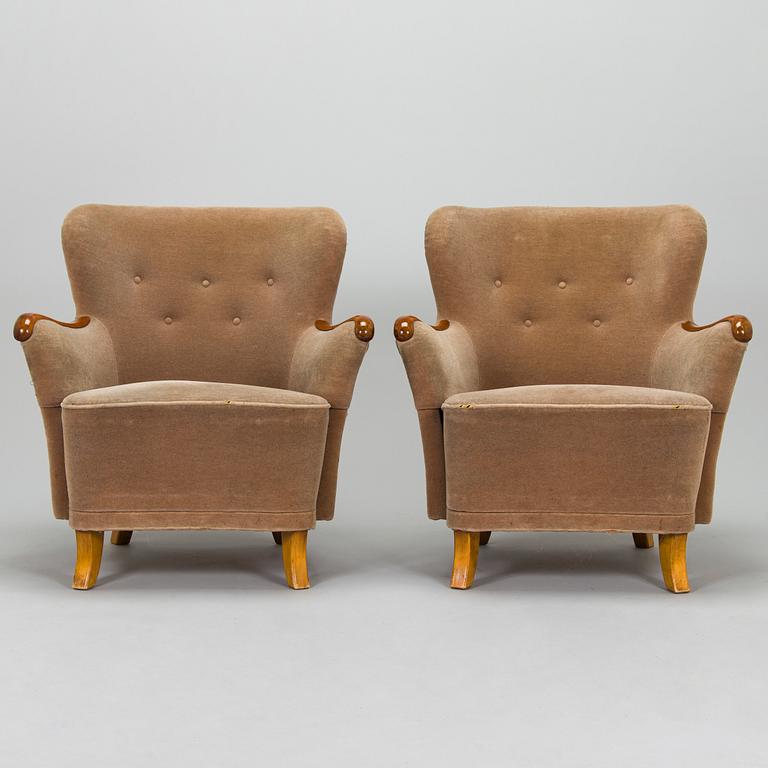 A pair of 1950's armchairs.