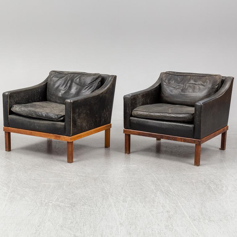 A pair of "The President" black leather armchairs by Ingemar Thillmark for OPE-möbler, Sweden.