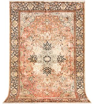 A silk Kashmar carpet, c. 280 x 177 cm.