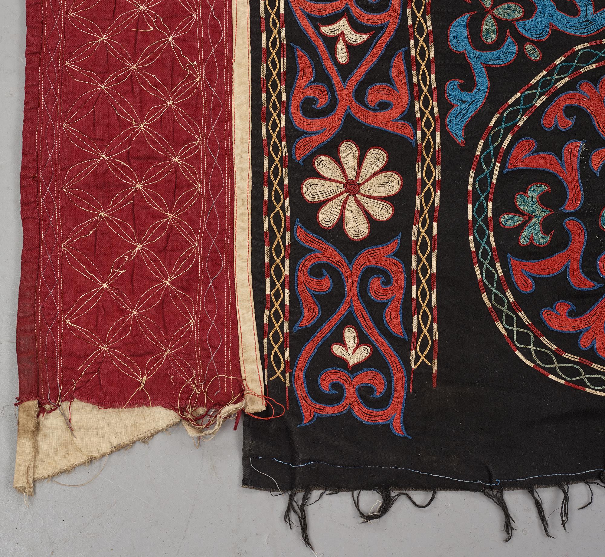 A Suzani textile, ca 247 x 128 cm.