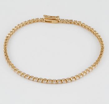 ARMBAND, 18K guld med briljantslipade diamanter ca 1.00 ct. Vikt 5,4 gram.