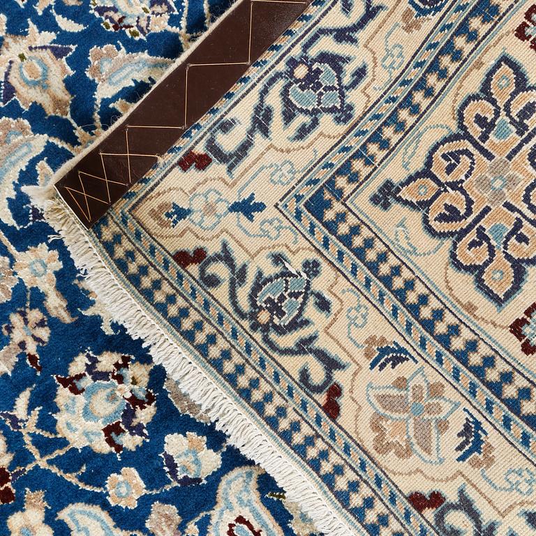 A Nain rug, part silk, 183 x 110 cm.