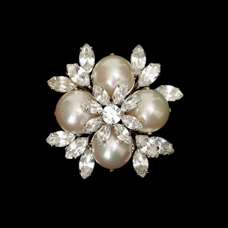 A brooch by Christian Dior.