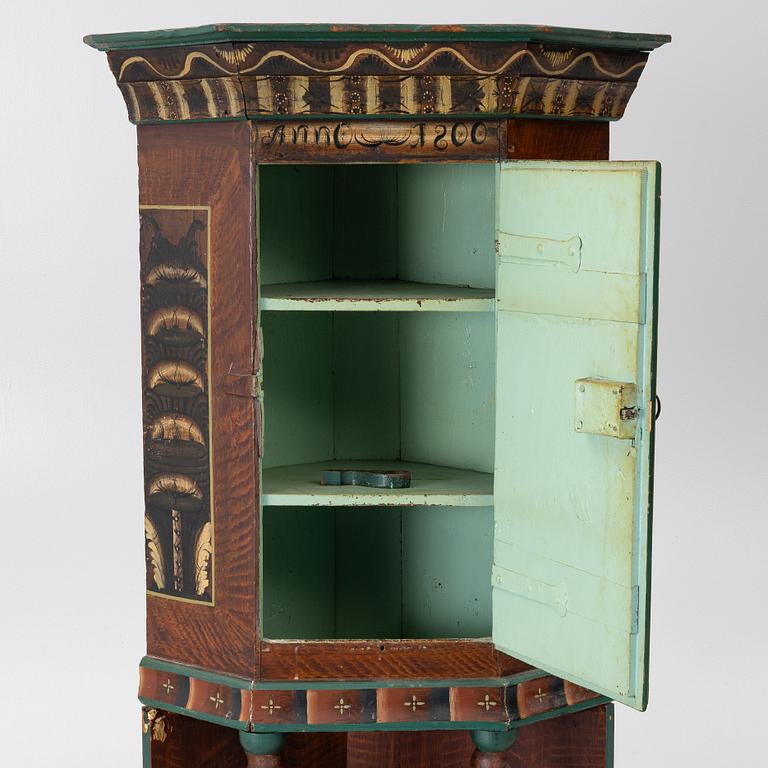 Corner cabinet, dated 1800.