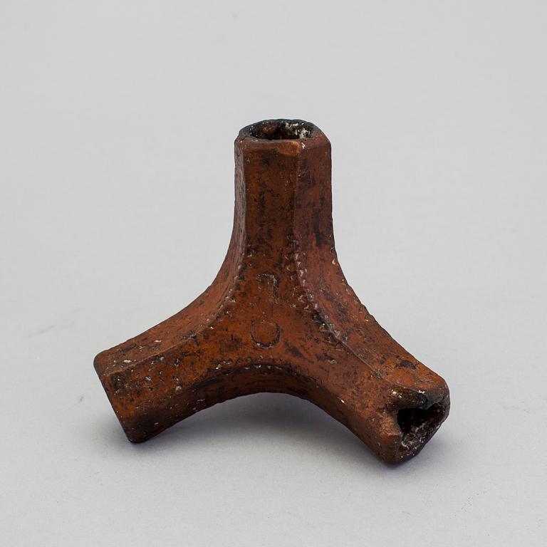A 19th century pottery folk art candle stick.