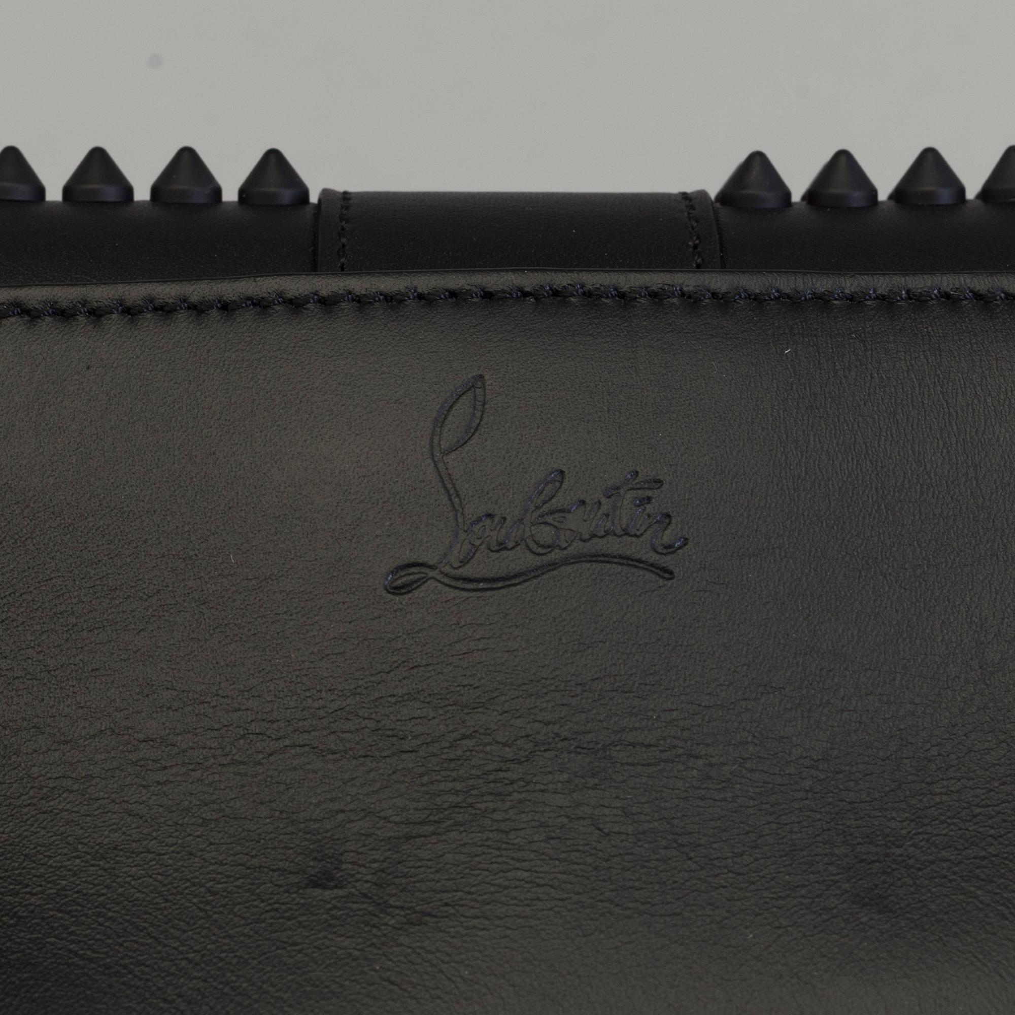 An eveningbag with studs by Christian Louboutin.