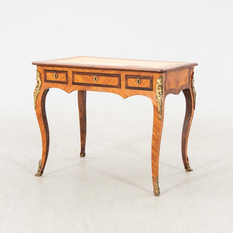 A Louis XVI style desk around 1900.