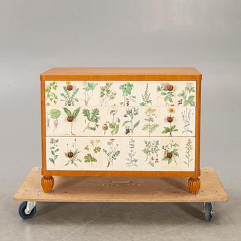 A 1940s elm chest of drawers.