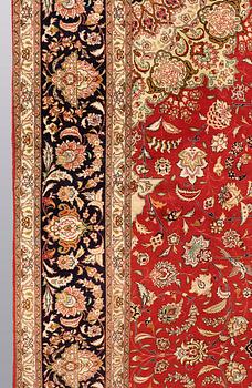 A carpet, Täbriz part silk, 341 x 248 cm.