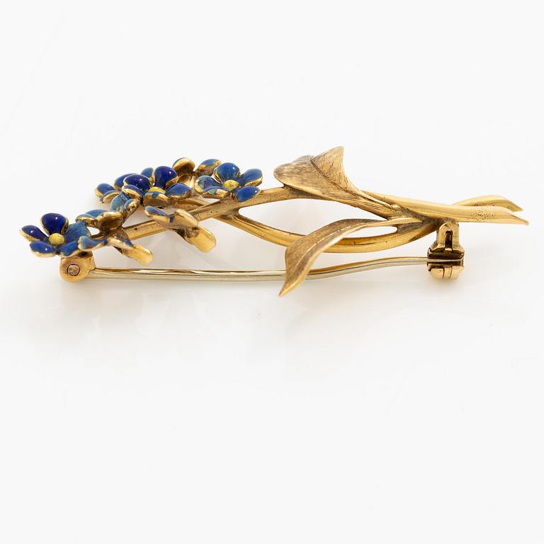 Brosch i form av en blombukett 18K guld med blå emalj.