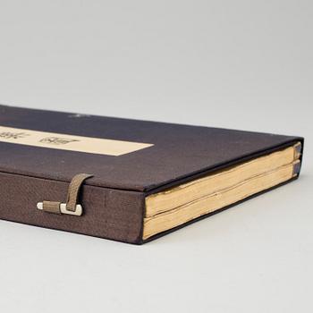 A Japanese book containing two volumes, Tokyo, circa 1900. Color woodblock prints.