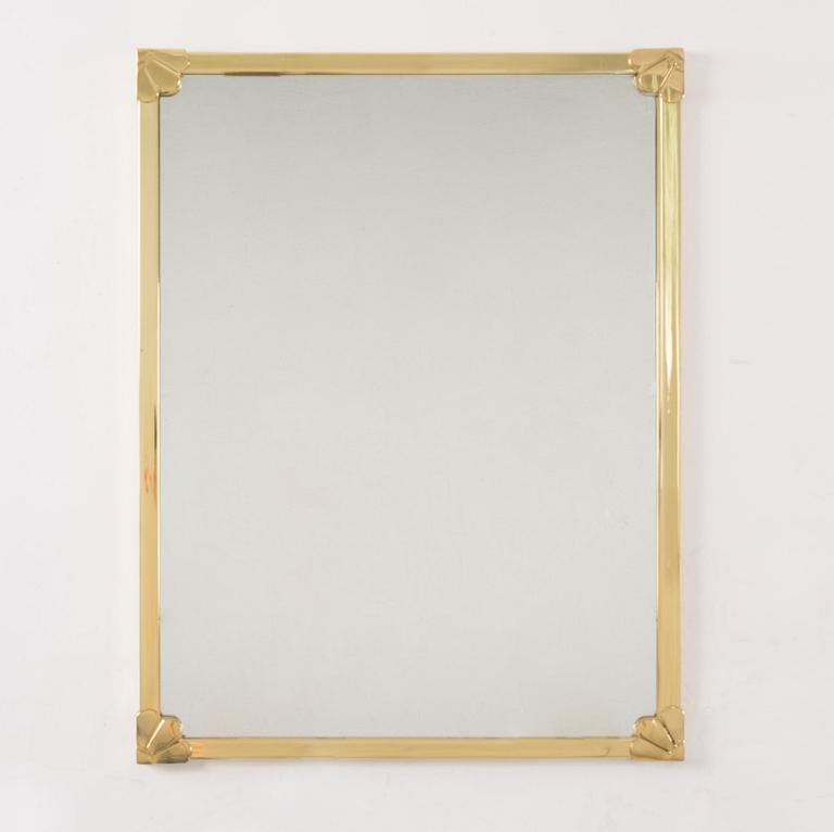 A morror in brass frame, 20th century.