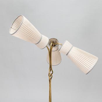 A three-arm floor lamp in brass, mid 20th century.