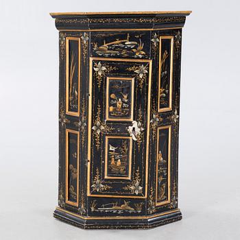 An 18th century corner cabinet.