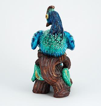 A Gunnar Nylund stoneware figure of a peacock.