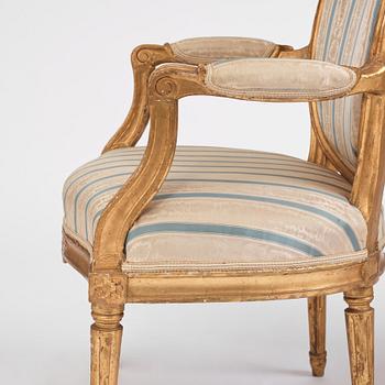 A pair of Gustavian giltwood open armchairs, late 18th century.