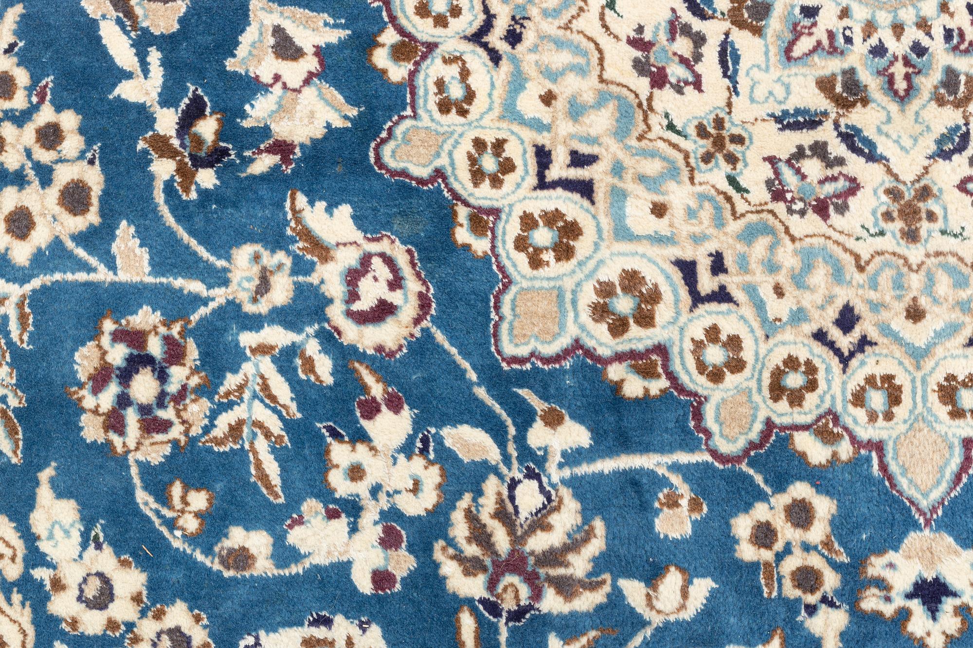 A Nain carpet, circa 310 x 196 cm.