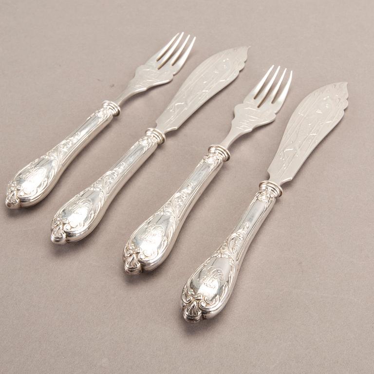 A German 20th century set of 12 fish cutlery low grade silver mark of F W Hespe hamburg early 1900s.