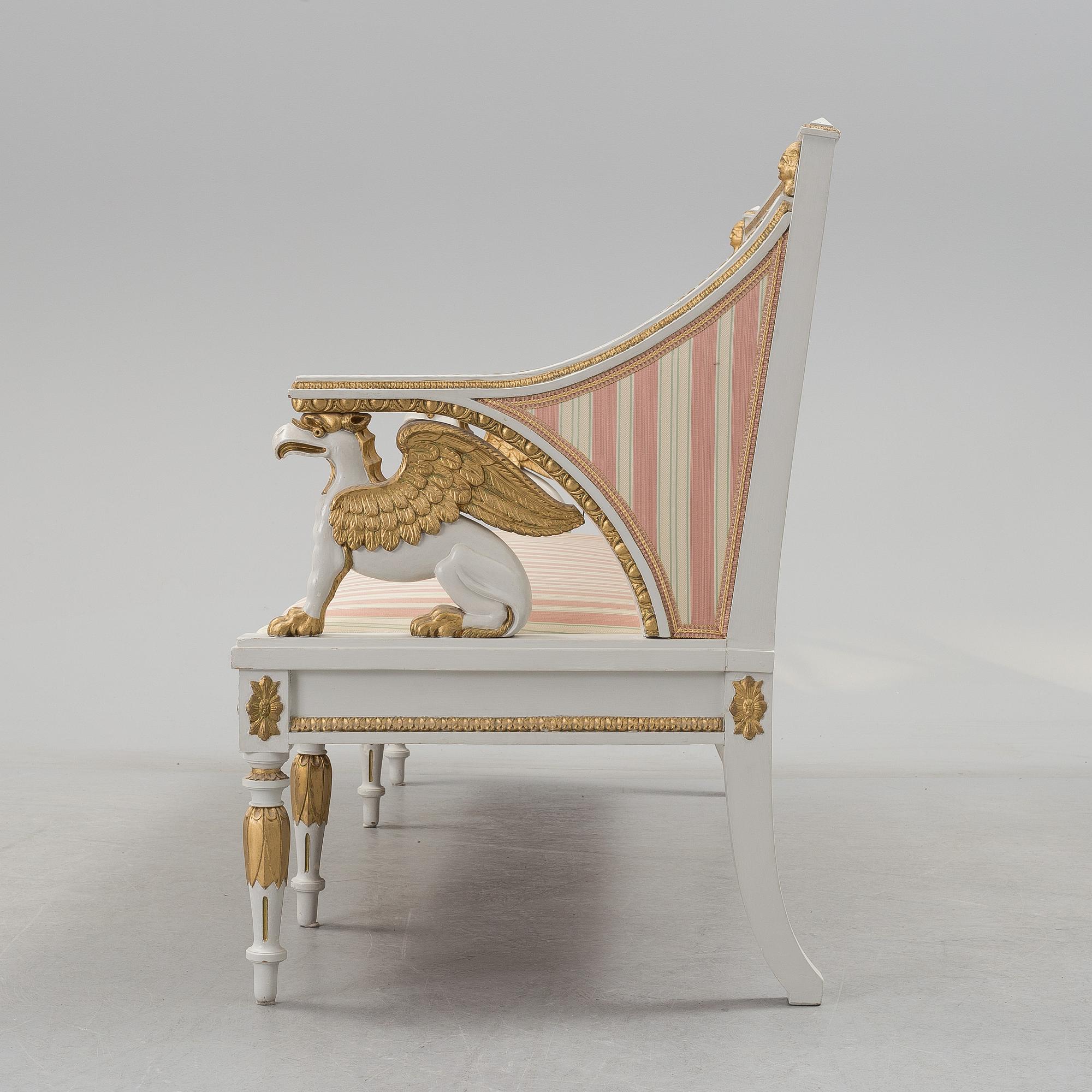 A set of two armchairs, a sofa, a stool and a chair. Early 20th century.