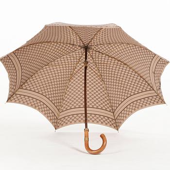 CÉLINE, a beige monogram umbrella.