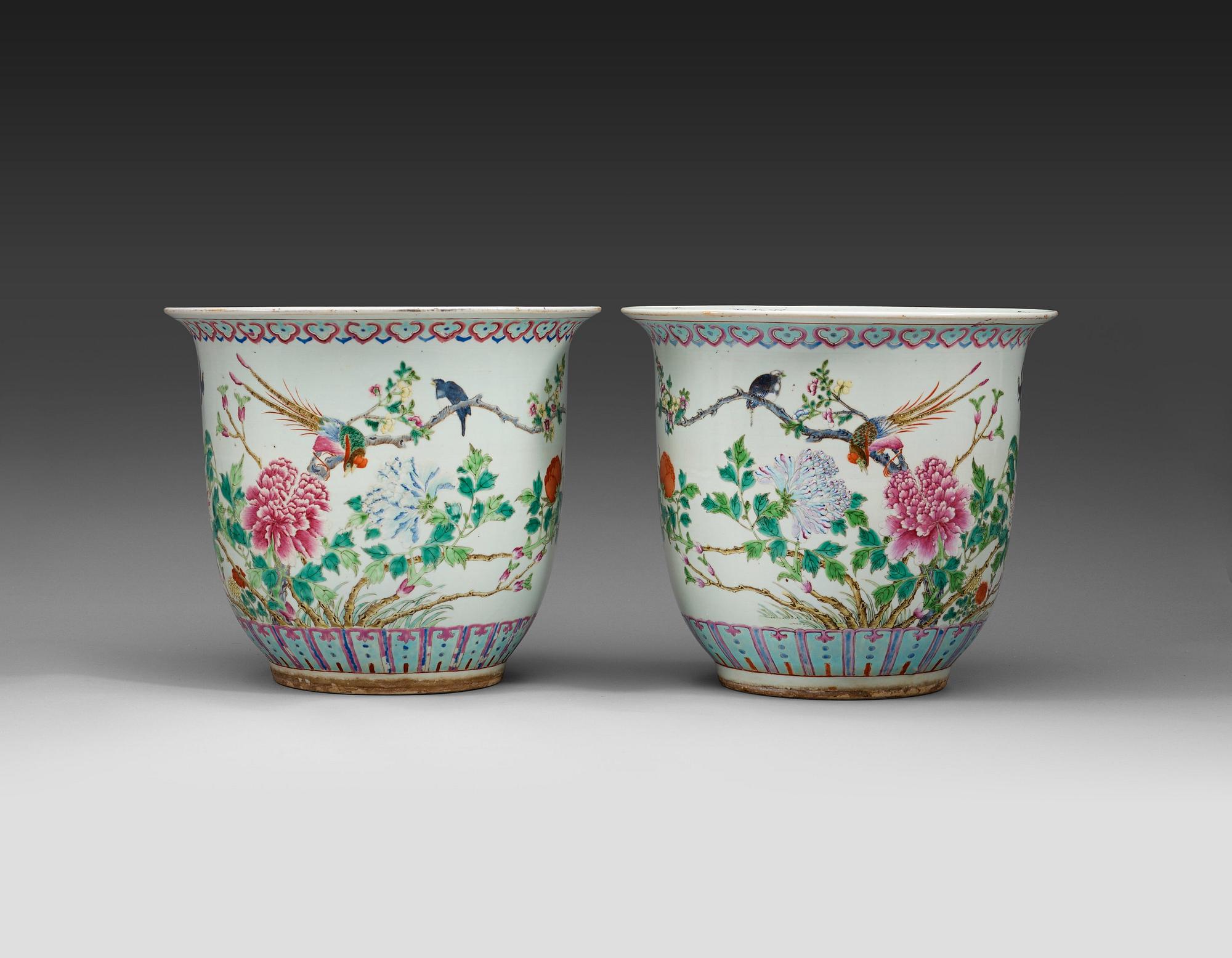 A pair of large flower pots enameled in 'famille rose' with birds and peonies, late Qing Dynasty (1644-1912).