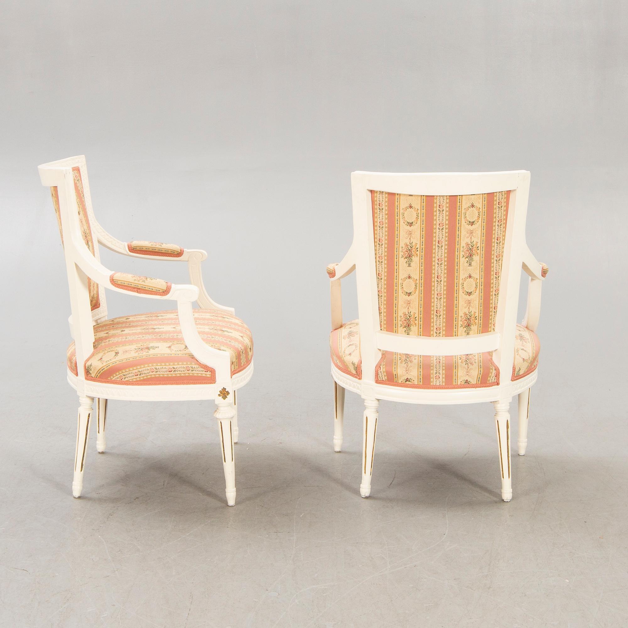 A pair of Swedish painted late Gustavian armchairs around 1800.