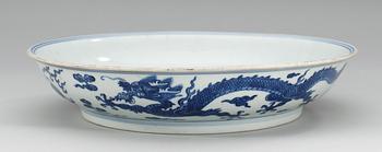 A blue and white ming style 'dragon' dish, Qing dynasty (1644-1912).