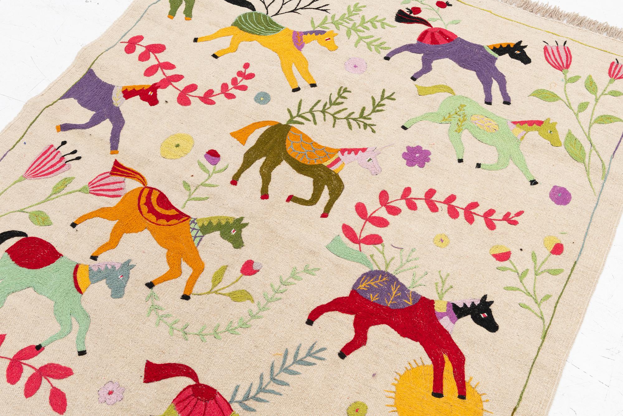 A hand-embroidered Kelim carpet, c. 208 x 150 cm.