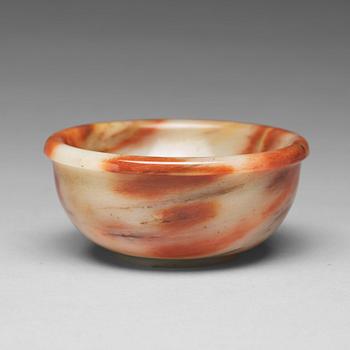 726. A sculptured stone bowl, China, early 20th Century.