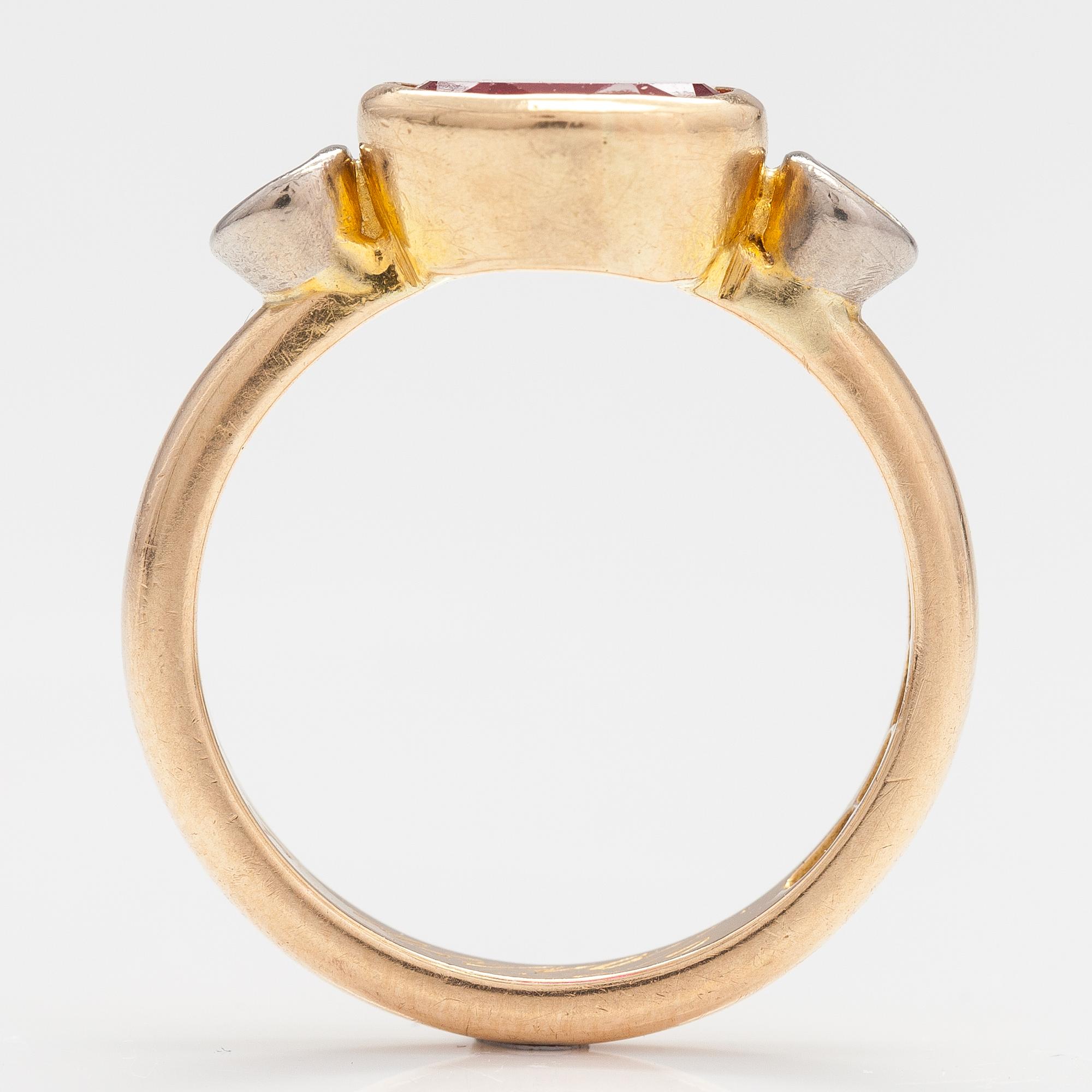 An 18K gold ring with a synthetic ruby and diamonds ca  0.22 ct in total. Lappi & K:ni, Lappeenranta 1925.