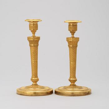 A pair of French Empire 19th century candlesticks.