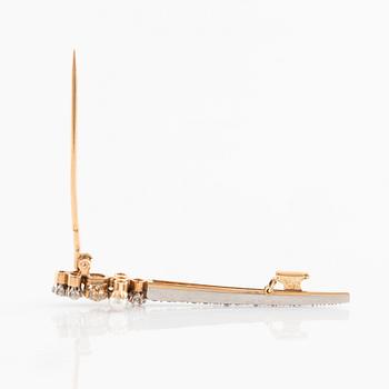 An 18K gold sword brooch set with old-cut diamonds and pearls.